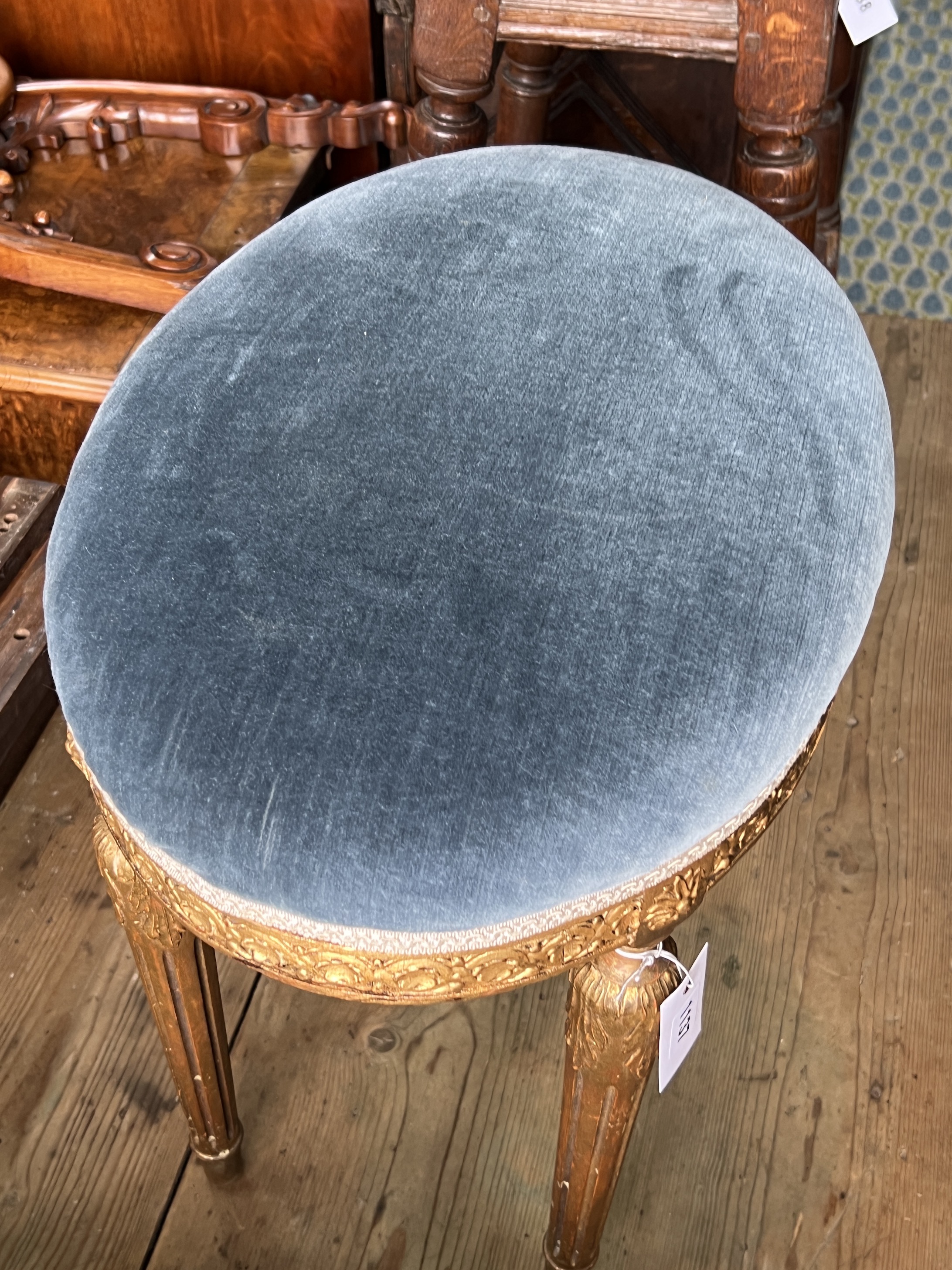 A George III style giltwood and composition oval dressing stool, width 50cm, depth 33cm, height 46cm